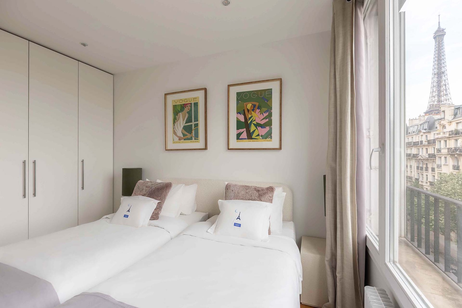 Bedroom 1 has view of Champ de Mars and Eiffel Tower to left.