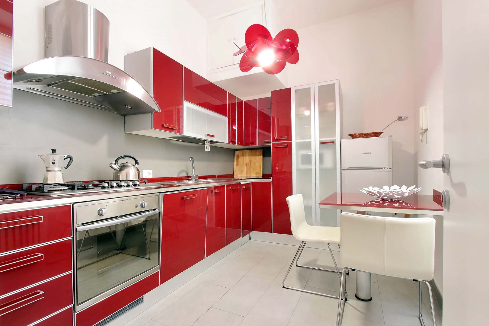 Bright kitchen that is well appointed and offers additional seating.