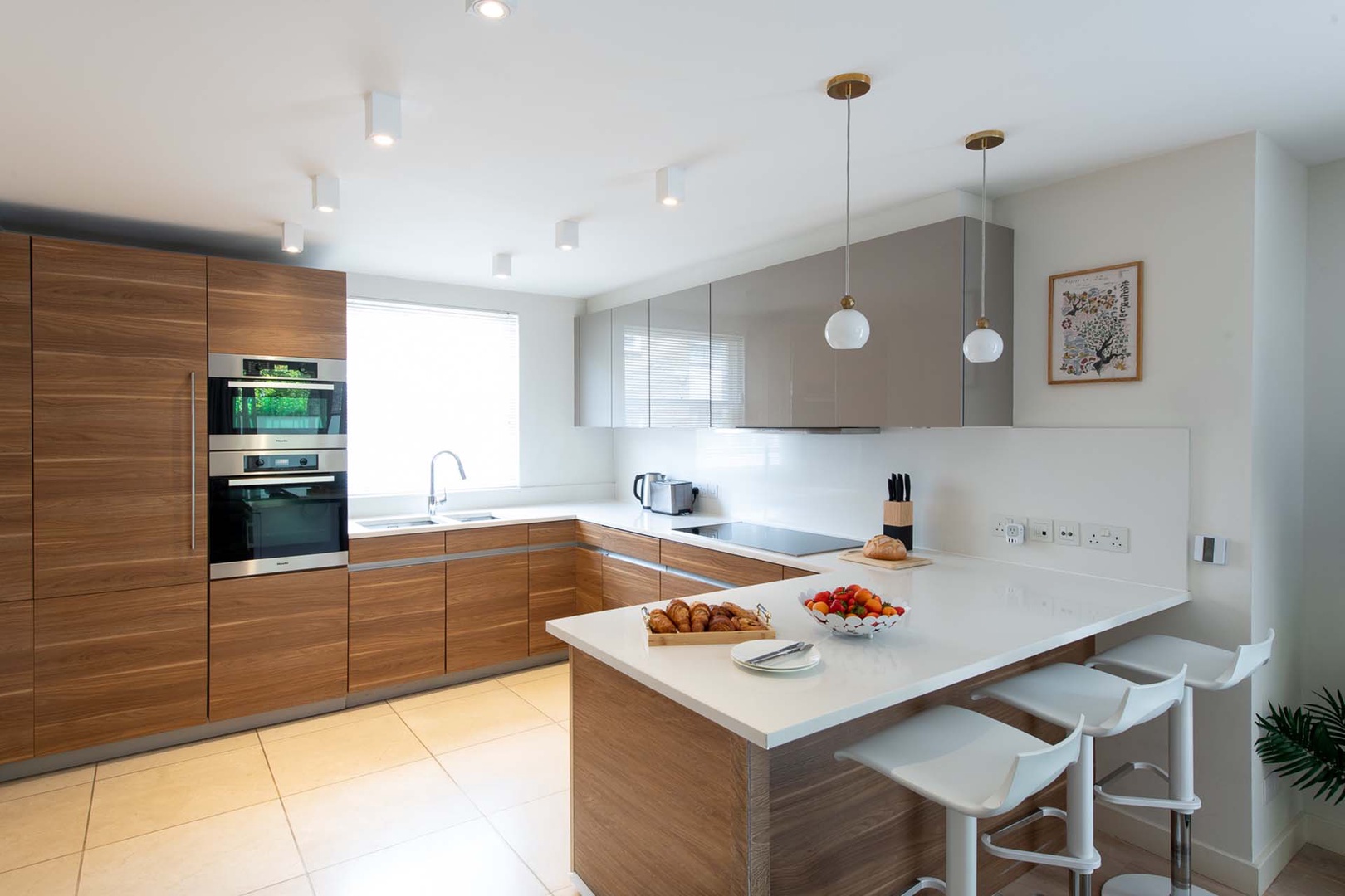 Kitchen is located on first level and has bar seating.
