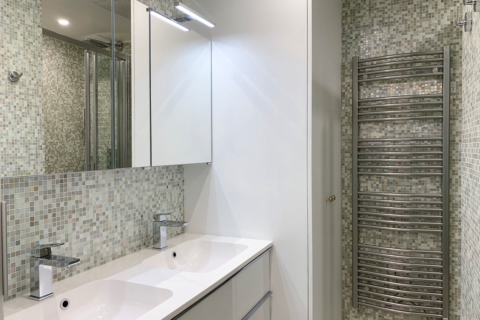 Bathroom 2 features a shower and two sinks.