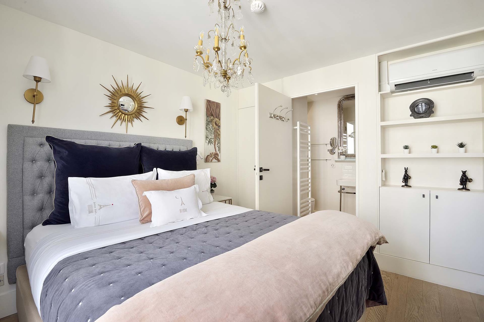 The bedroom has a modern en suite bathroom.