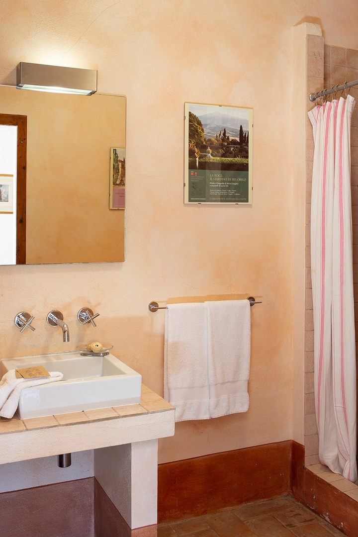 En suite bathroom is fitted with a shower, sink, toilet and bidet.