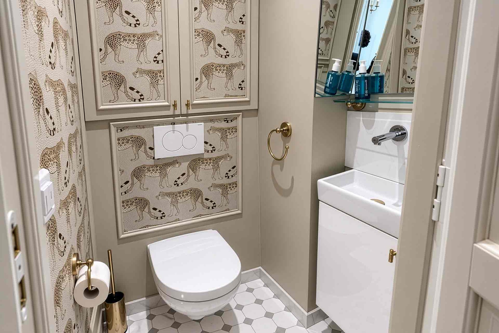 Half bathroom located near apartment entrance.