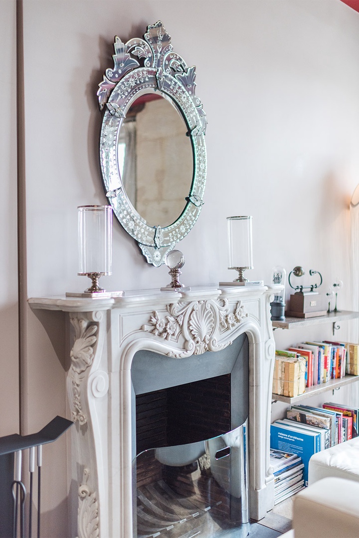 The elegant decorative fireplace is a feature in the living room.