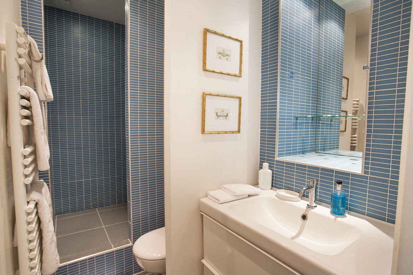 Start your day in the cozy bathroom, which features a heated towel rack for extra comfort.