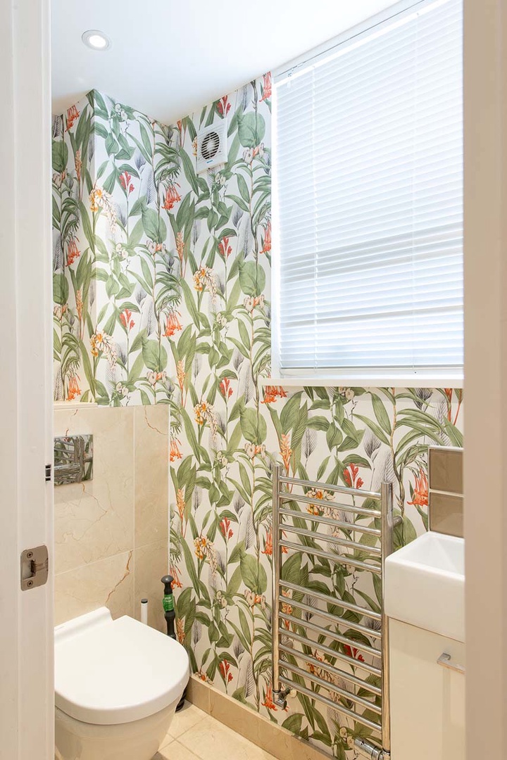 Powder room located on first level off of kitchen.