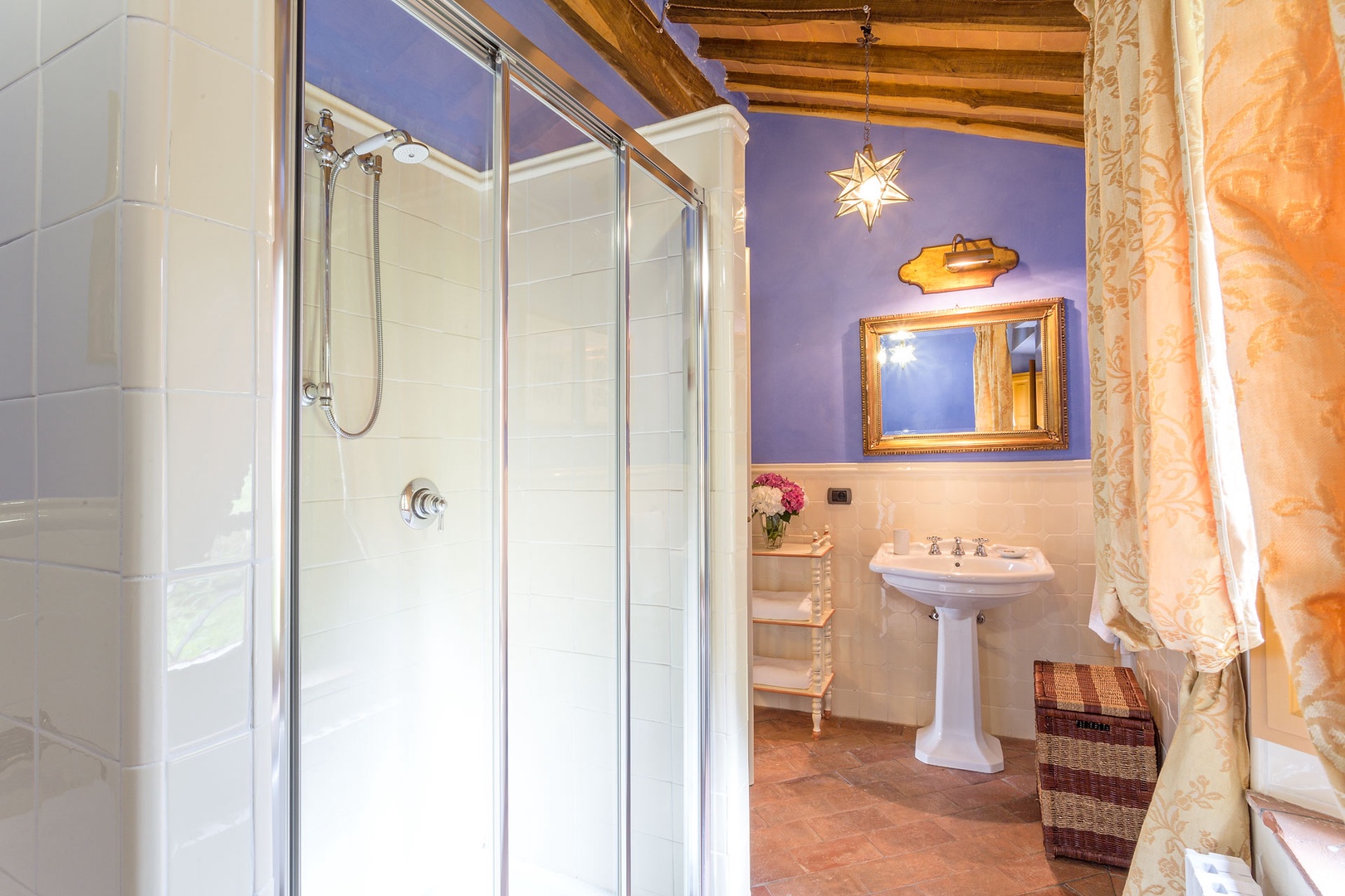 En suite bathroom with bathtub and shower