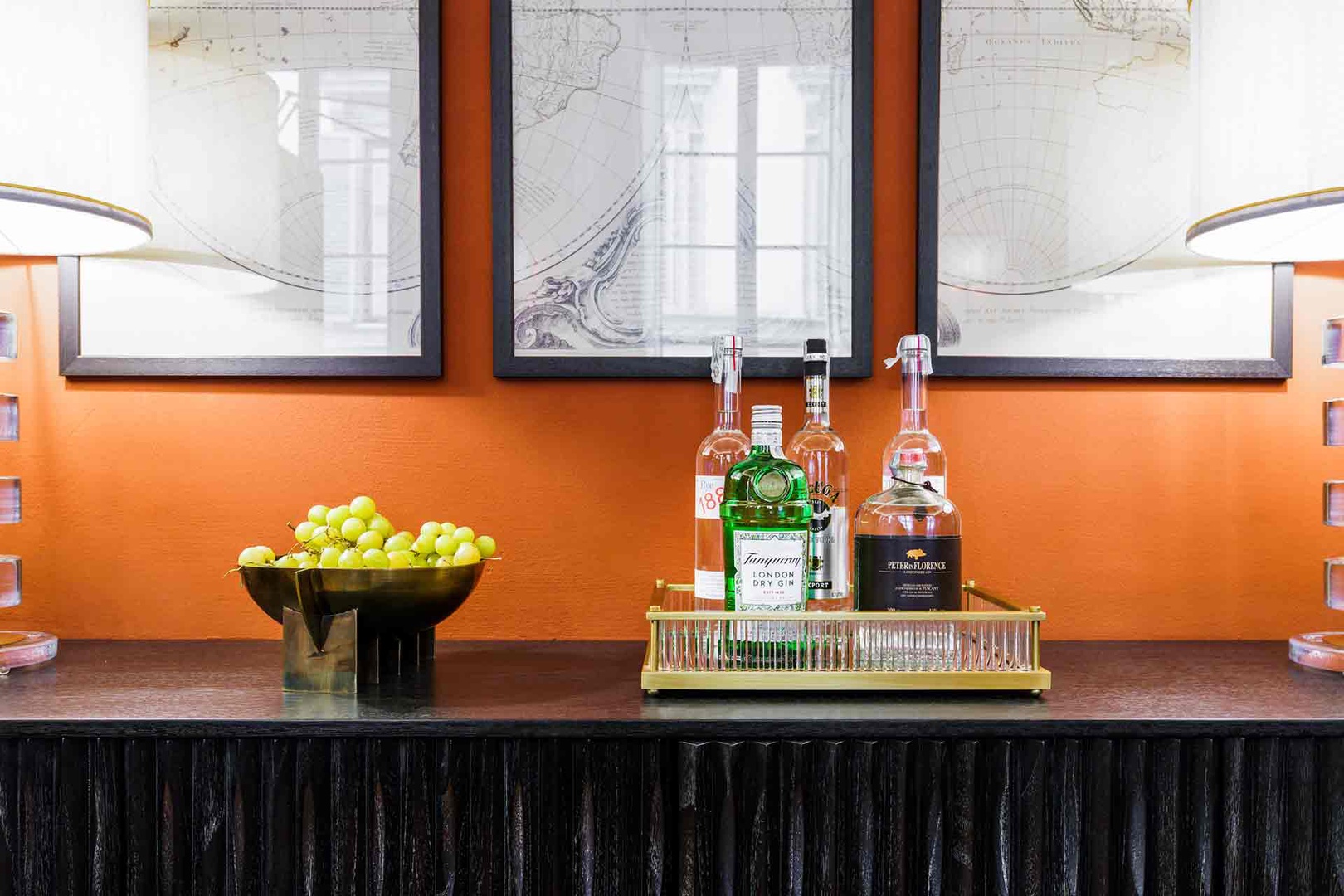 Enjoy a refreshing drink from the stylish bar setup.