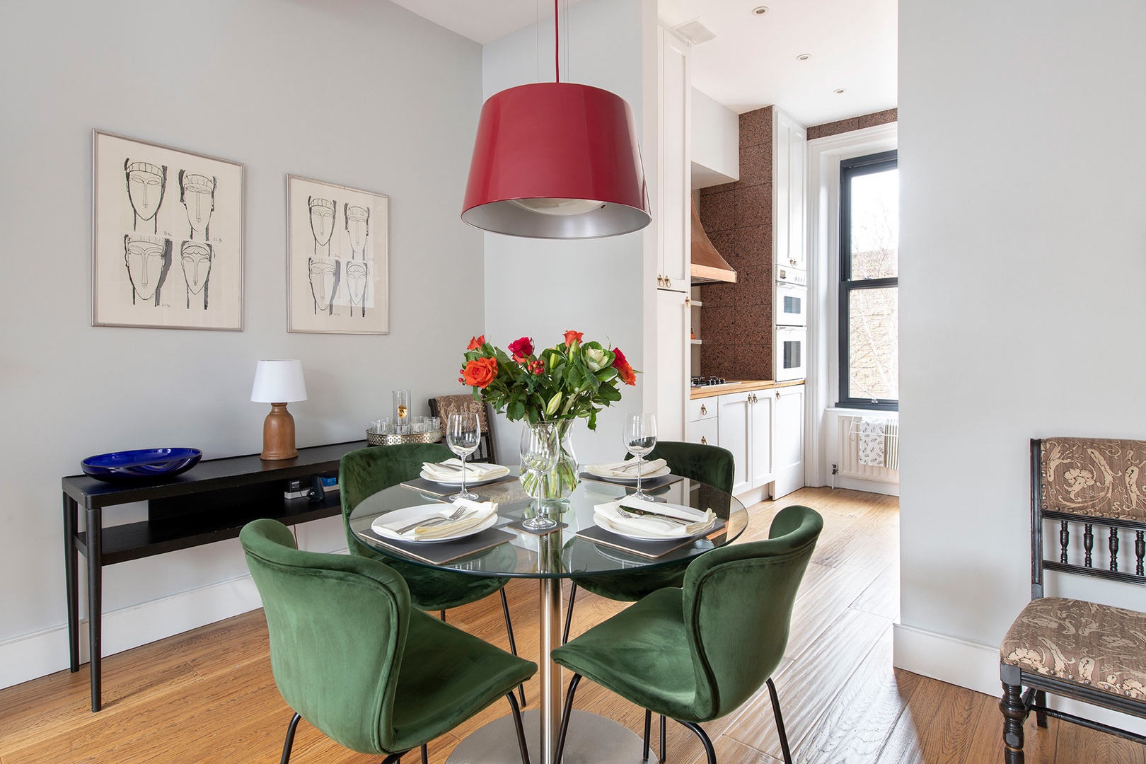 Comfortable seating around the glass-topped dining table.