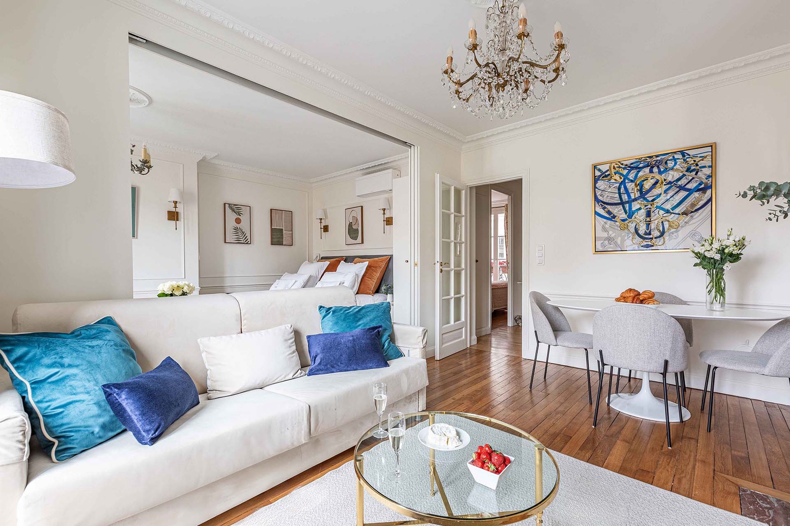 Open plan living room and dining area with sliding door to create privacy in bedroom 2.