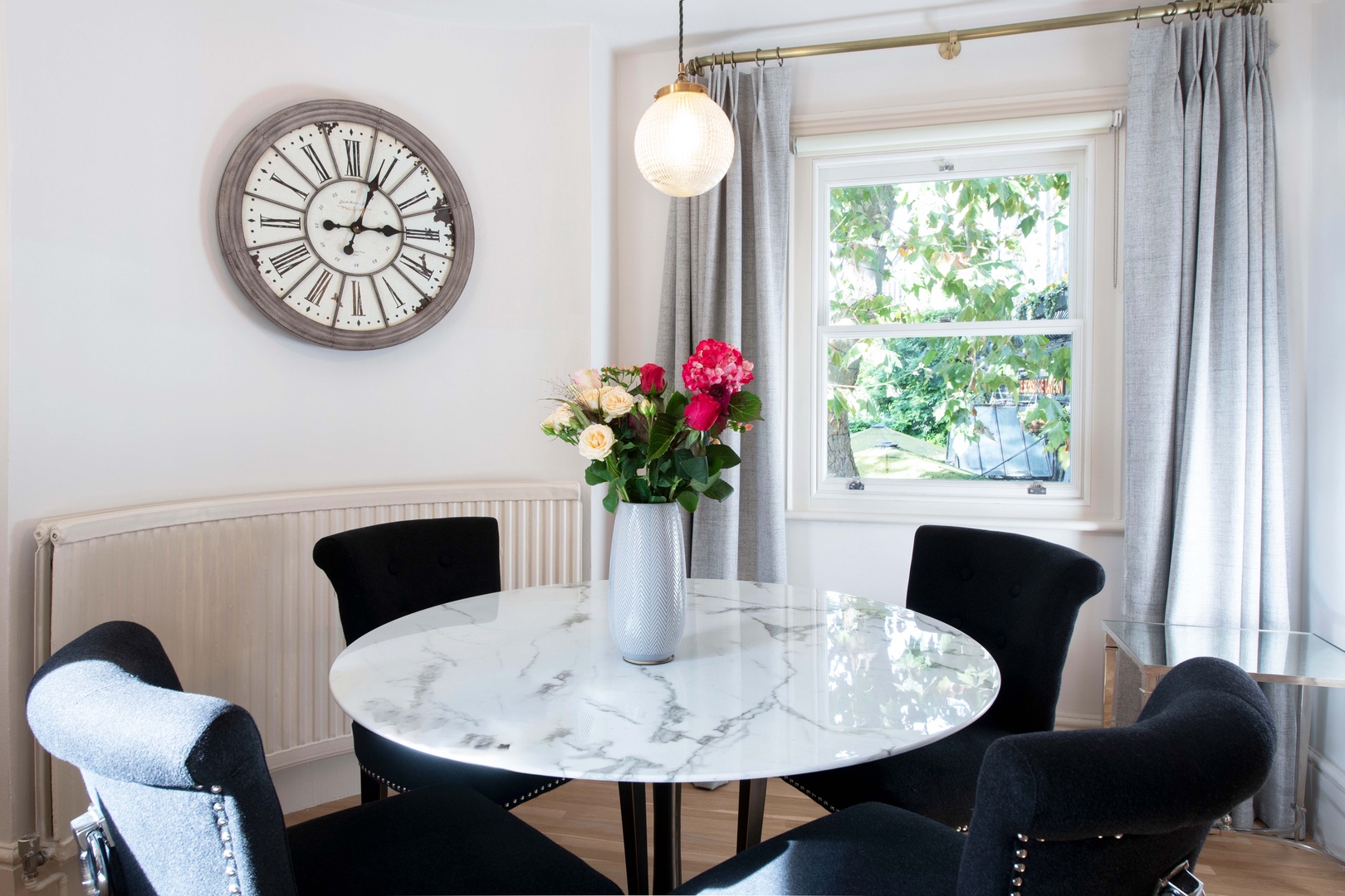 Light-filled dining area is comfortable and elegant.