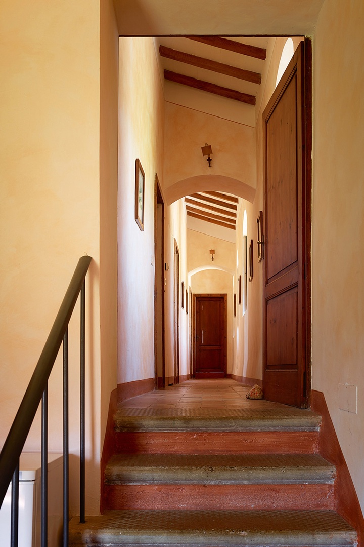 Steps leading to the living room and bedrooms from the kitchen.