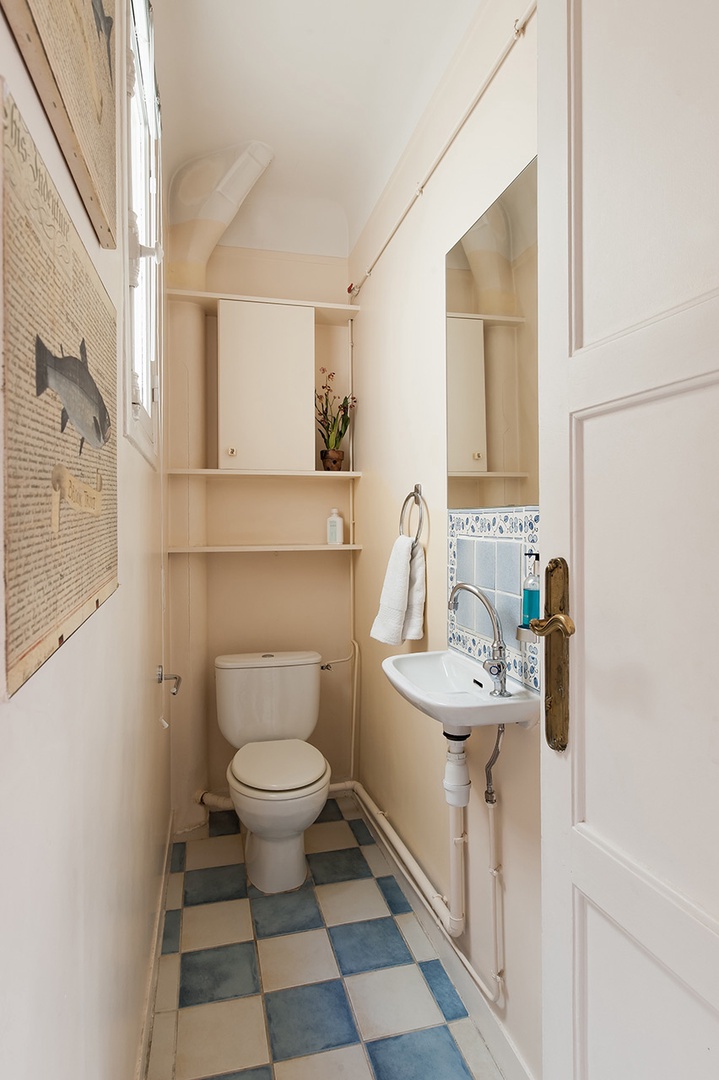 An additional half bath is located off the main corridor.