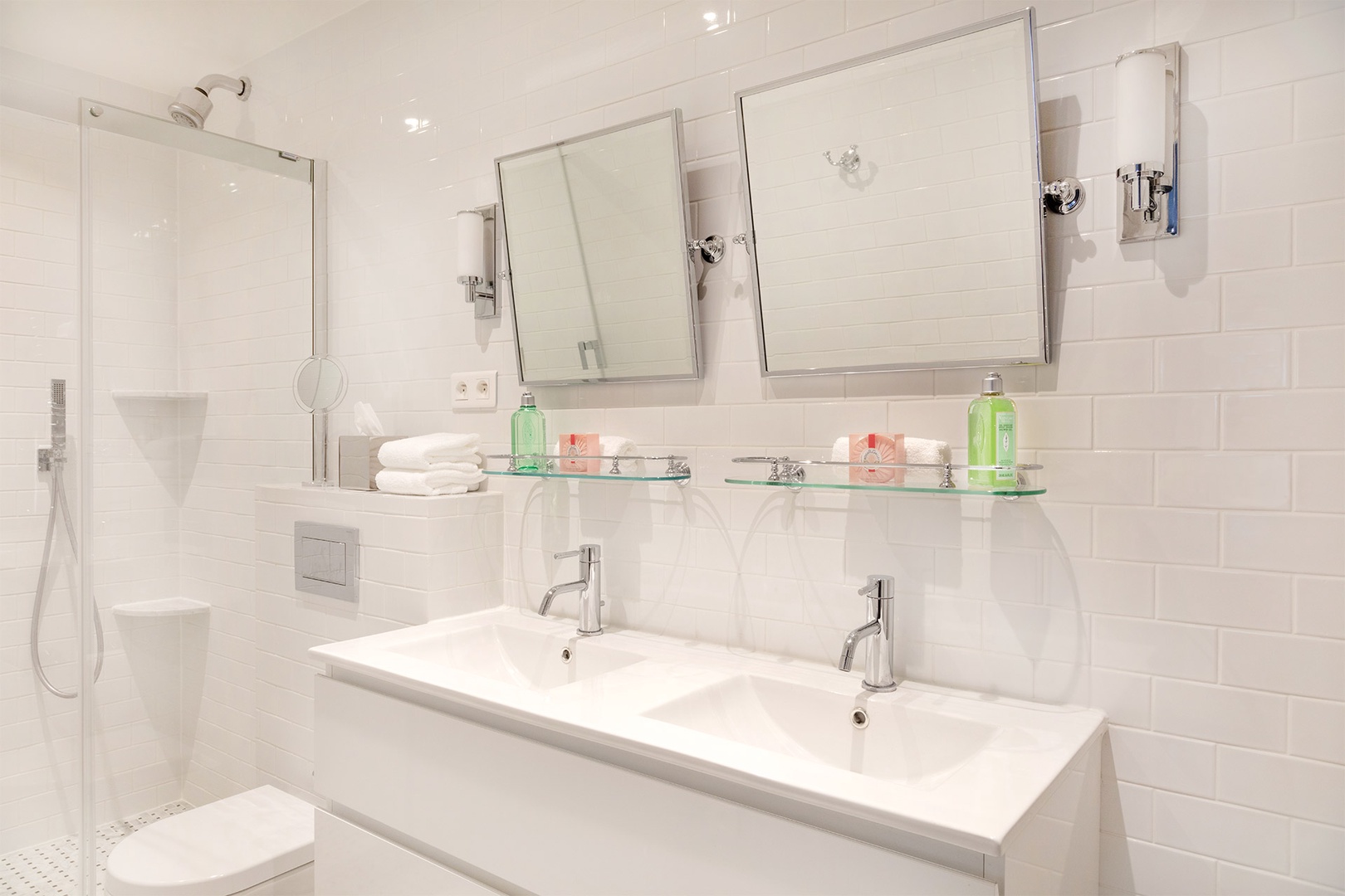 The en suite bathroom is equipped with a shower, toilet and double sink.