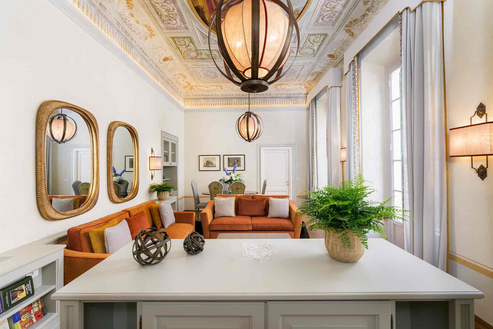 Relax in your elegant living space beneath a stunning hand-painted ceiling,
