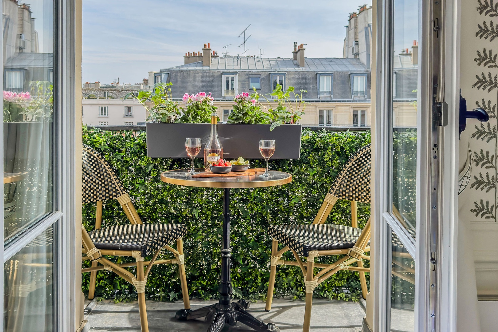 Step out from the bedroom to the balcony with bistro table.