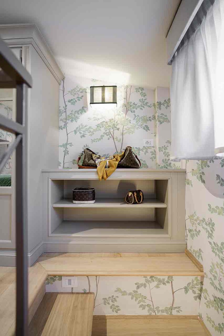 A set of stairs takes you to a third level of the apartment and cozy bedroom 1.
