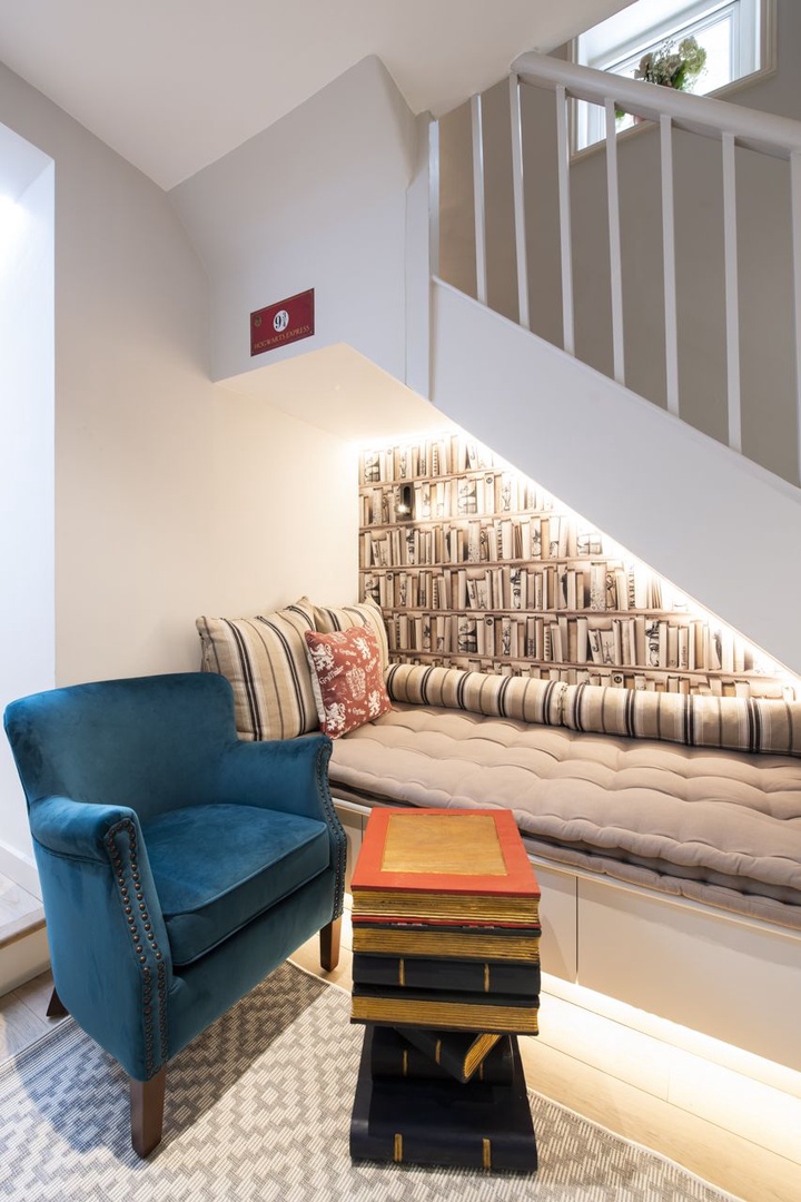 Get cozy in this little nook under the stairs