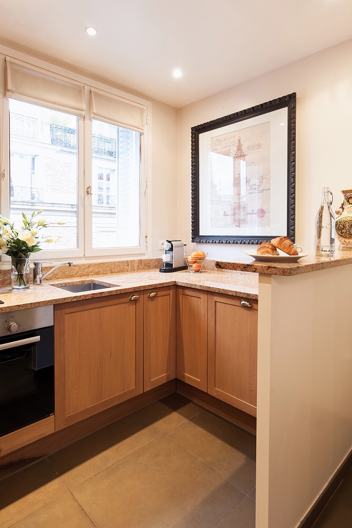 Large windows in the kitchen let in lots of natural light.