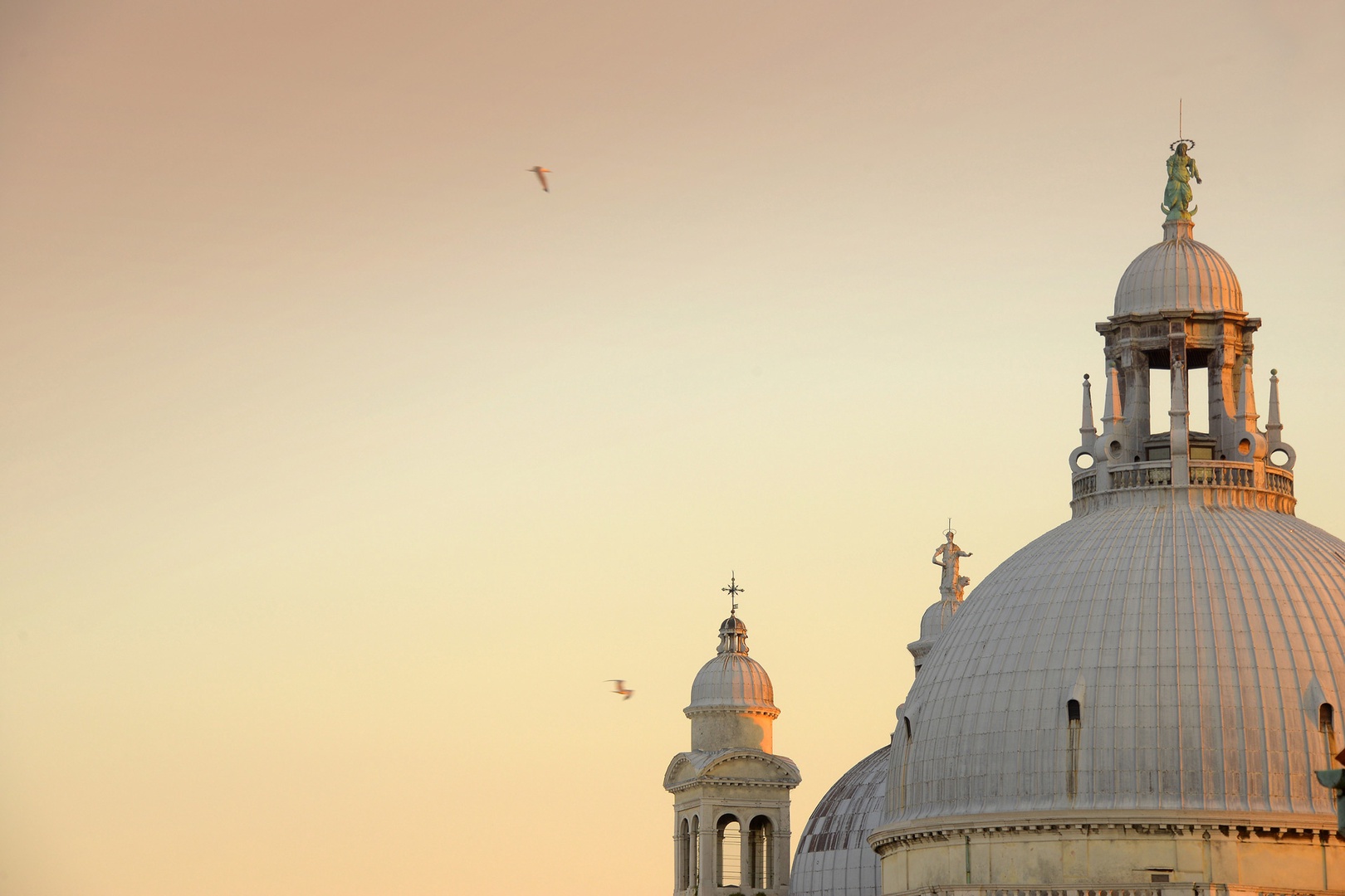 The cupola of Santa Maria Salute, across the grand canal peeks over the roof.