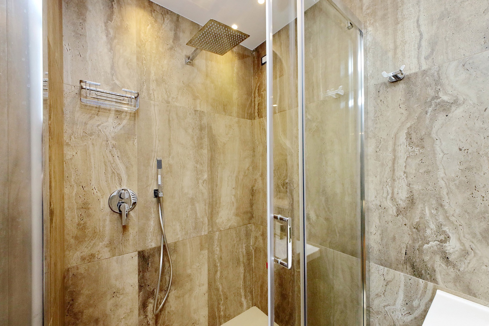 Shower with fixed and flexible showerheads