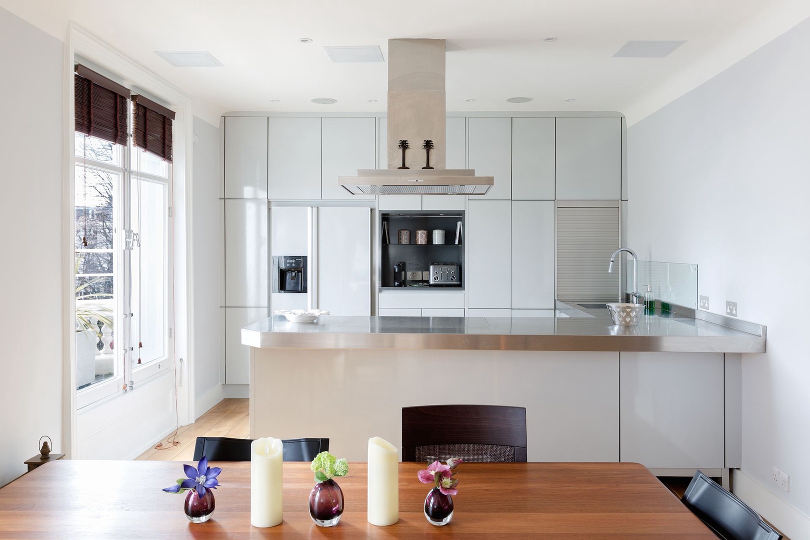 The fully-equipped kitchen is modern and sleek