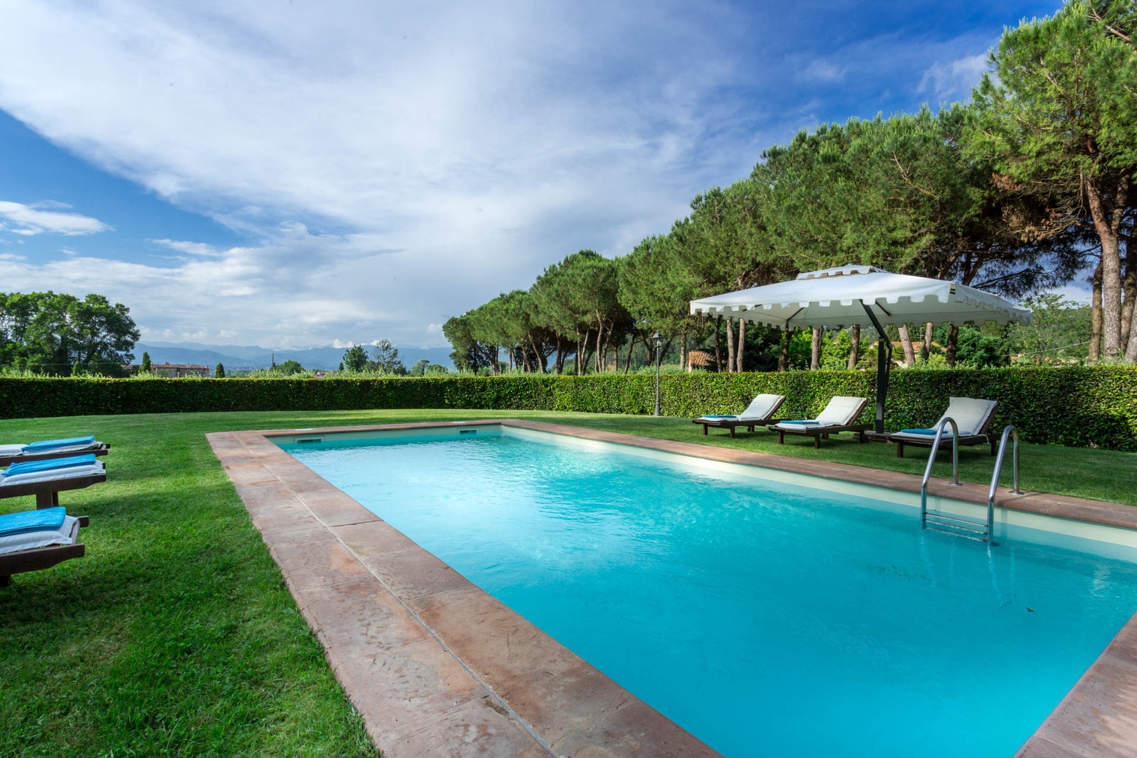 Enjoy fantastic views of the valley and Tuscan countryside while relaxing by the pool