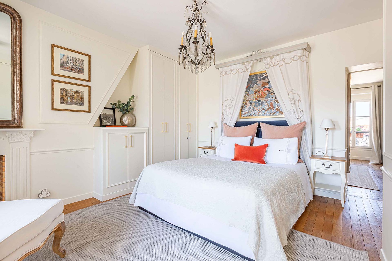 Relax in the spacious bedroom with a romantic canopy bed design.