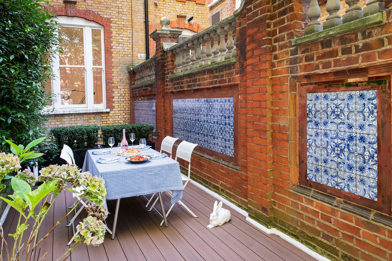 The terrace is adorned with blue and white tiles.