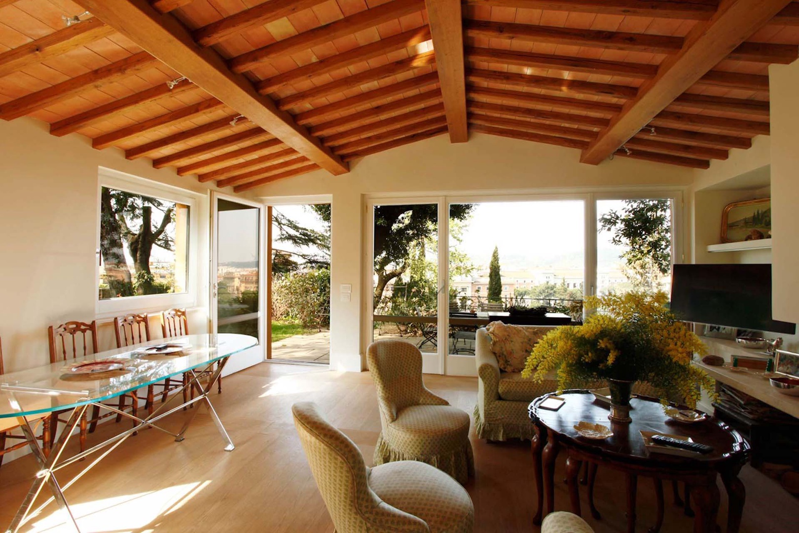Light filled living room overlooks the terrace and the city.