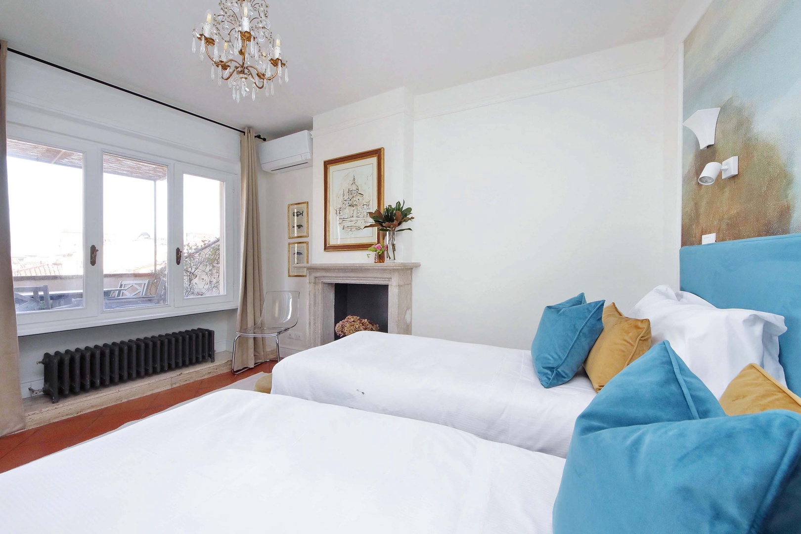 Sink into crisp white linens with vibrant blue accents as sunlight streams through your windows, creating a serene retreat.