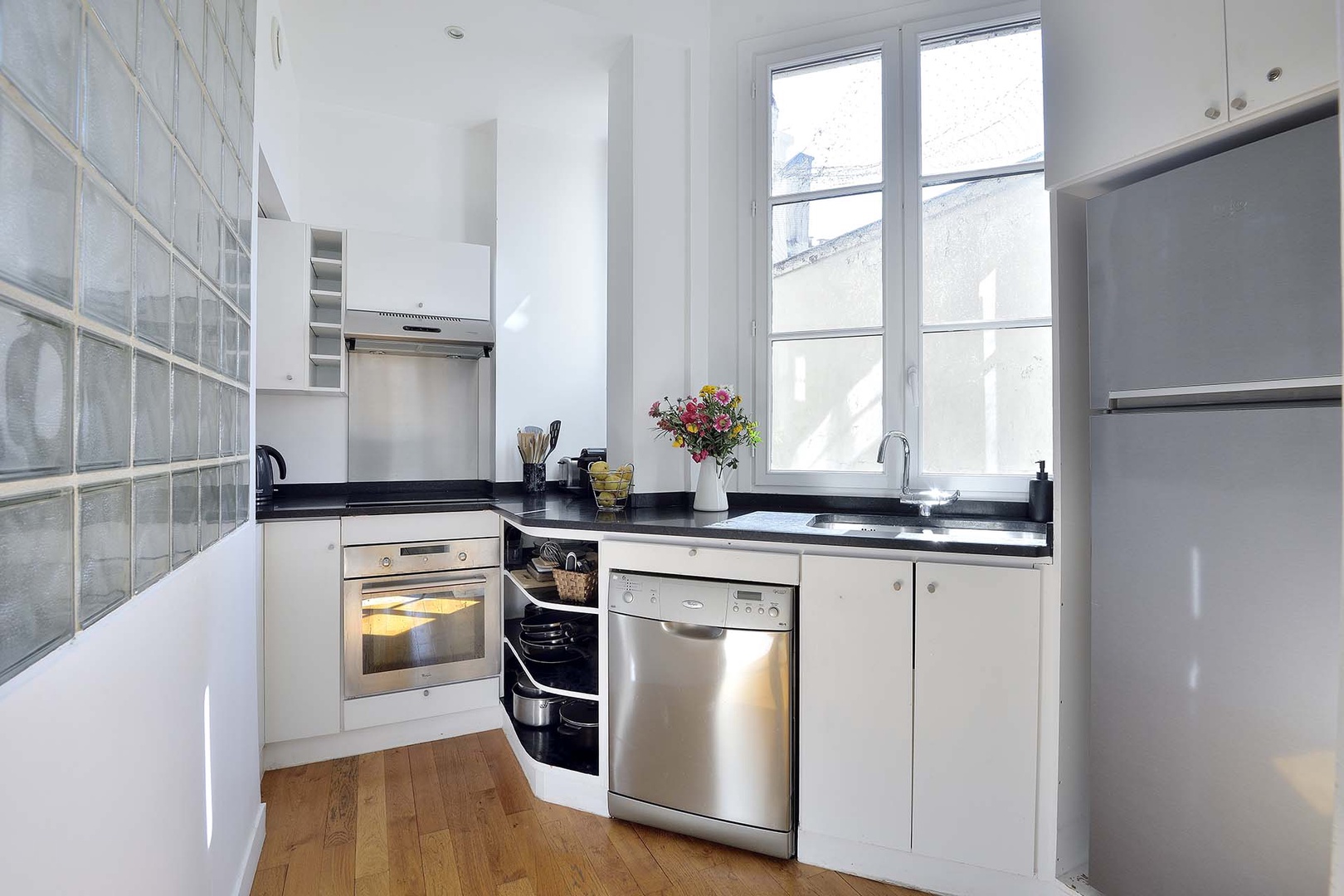 Fully-equipped kitchen has great light.