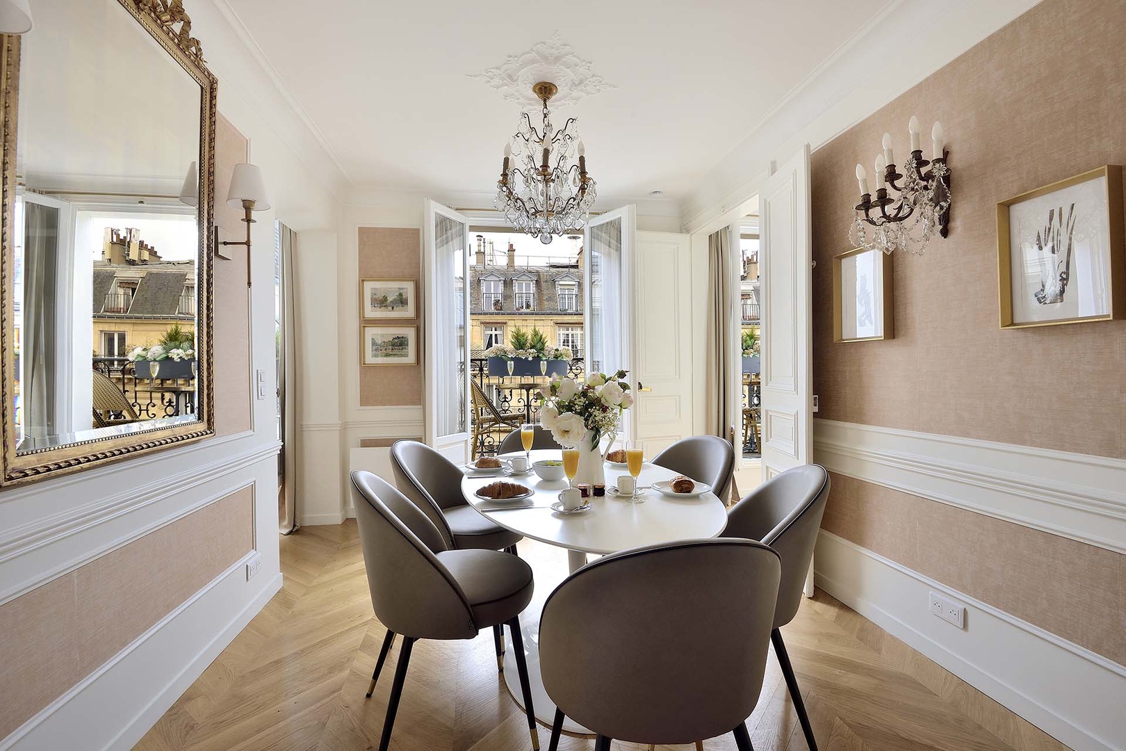 Enjoy meals around the table with a romantic  view of Parisian roof tops.