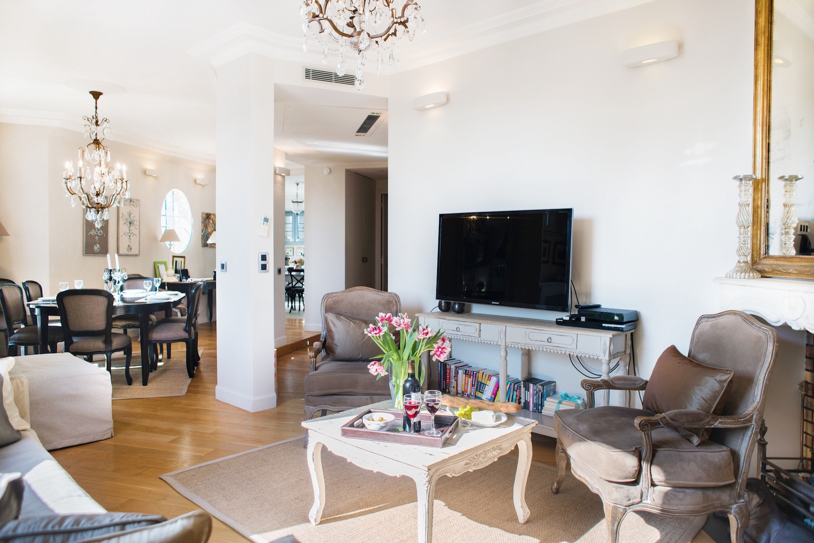 Elegant and spacious living area is full of light.