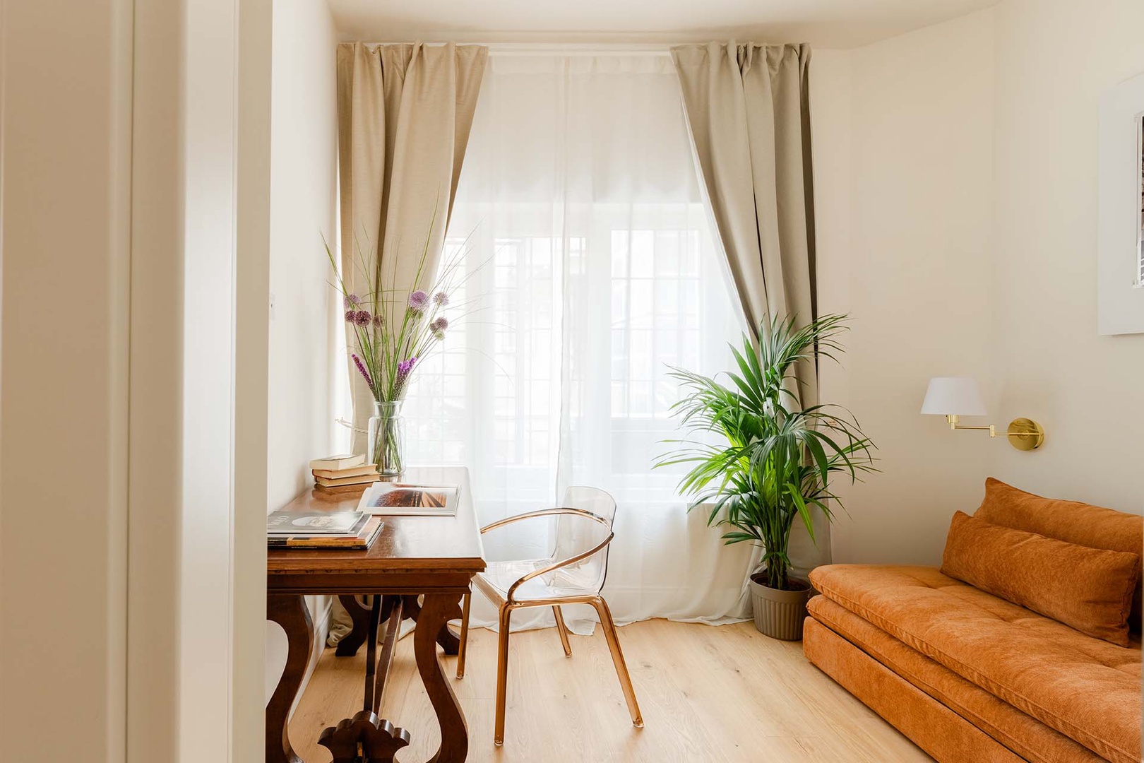Cheerful study with sofa and desk.
