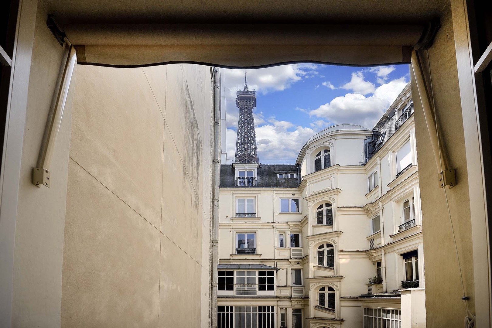 View of the Eiffel Tower over the courtyard from bedroom 1.