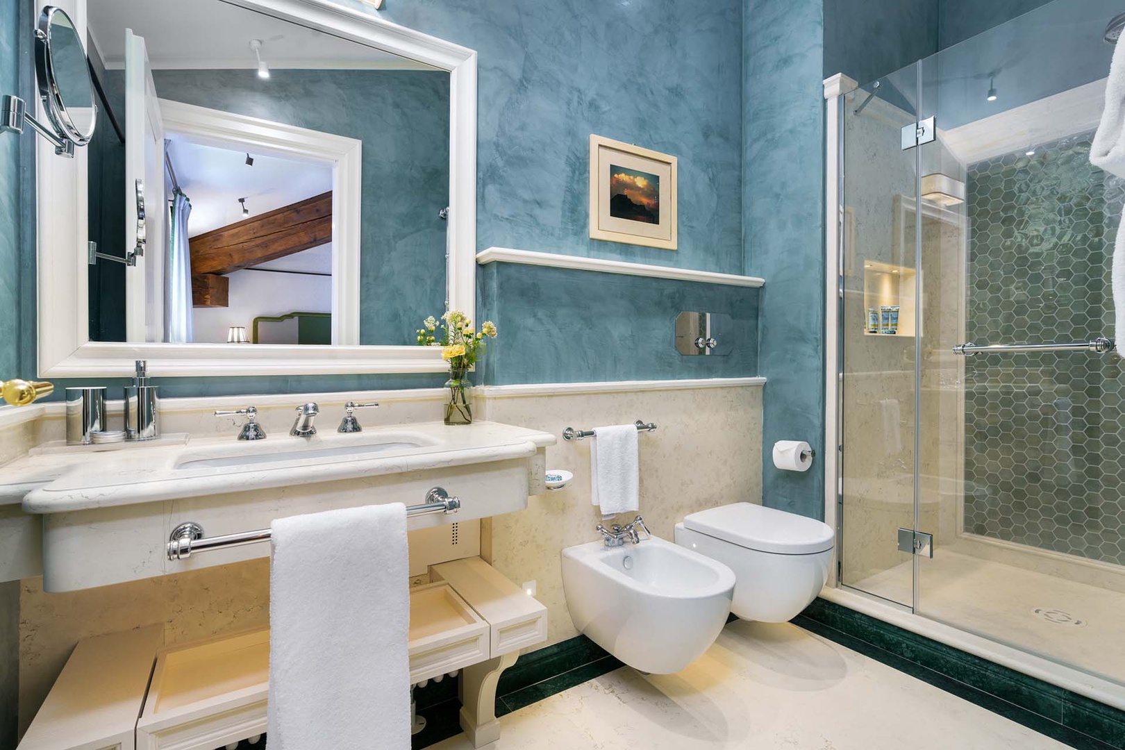 En suite bathroom for bedroom 1 with shower, toilet and sink.