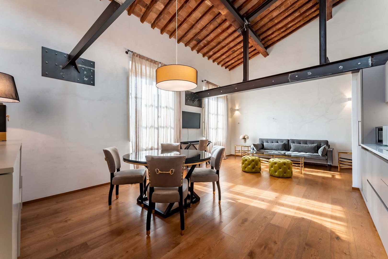 Large open-plan living area with soaring ceiling.