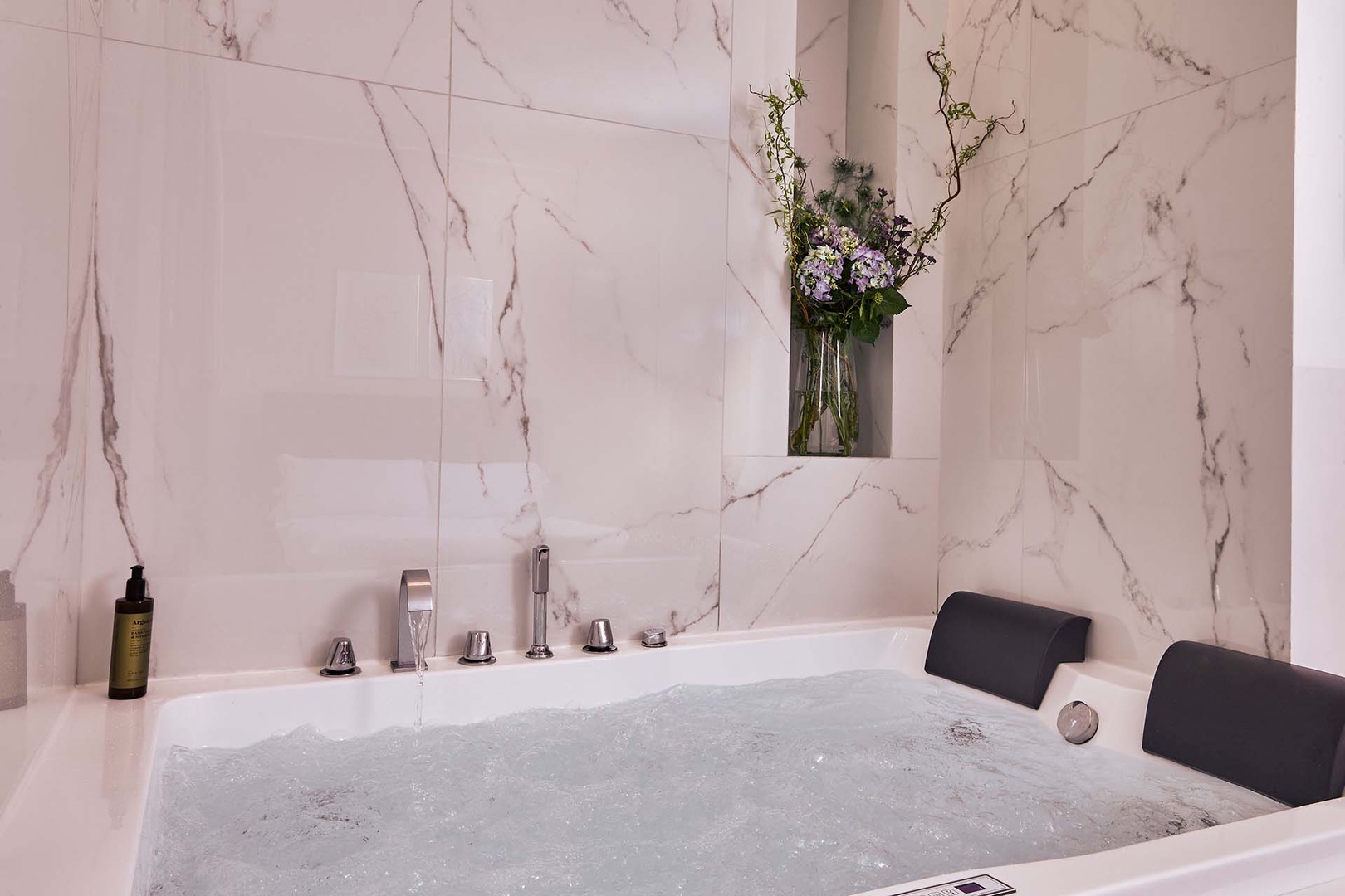 Relax in the dual  jacuzzi tub in bedroom 1.