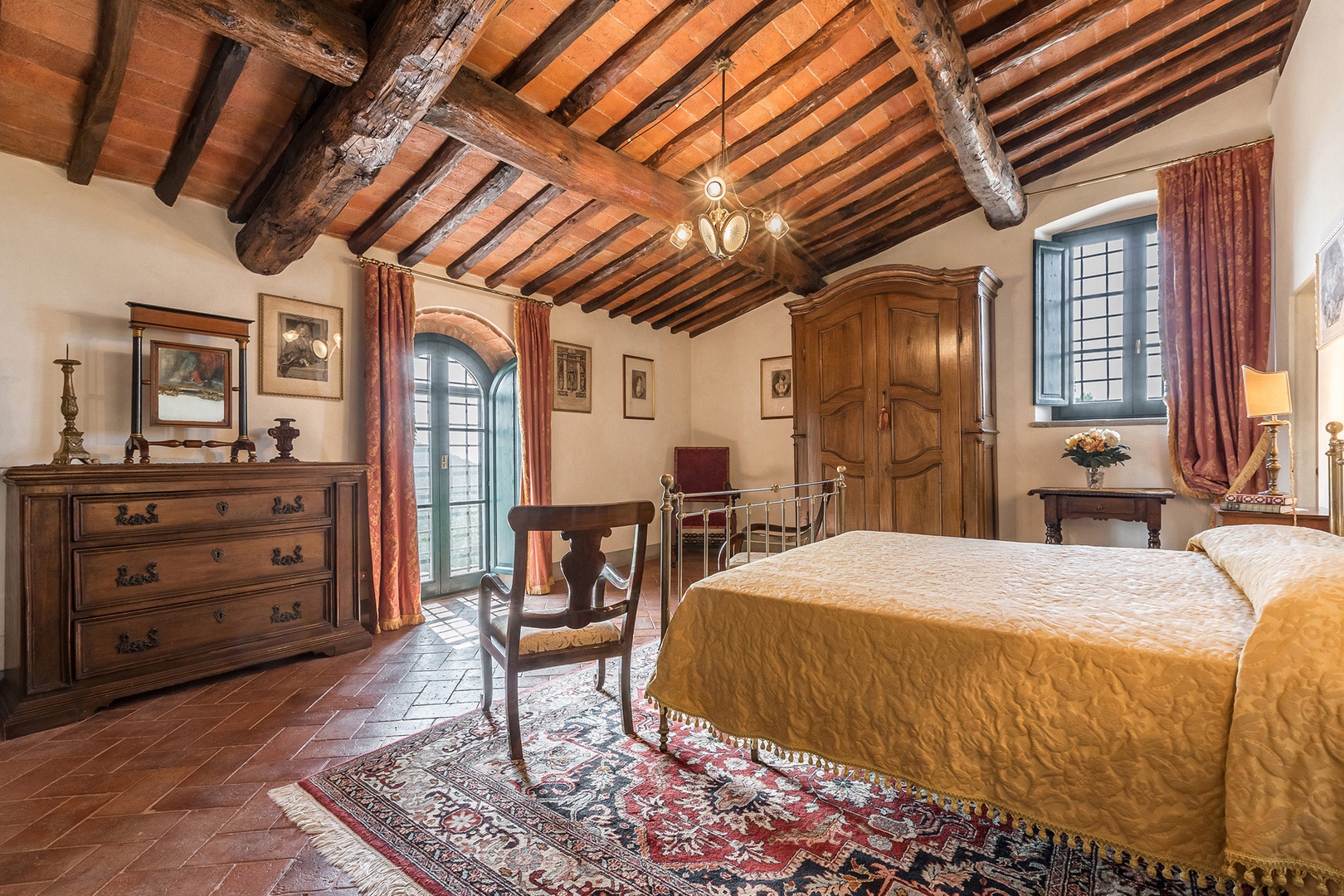 Beautiful beamed ceilings in bedroom 1 with views of Monsummano Alto.