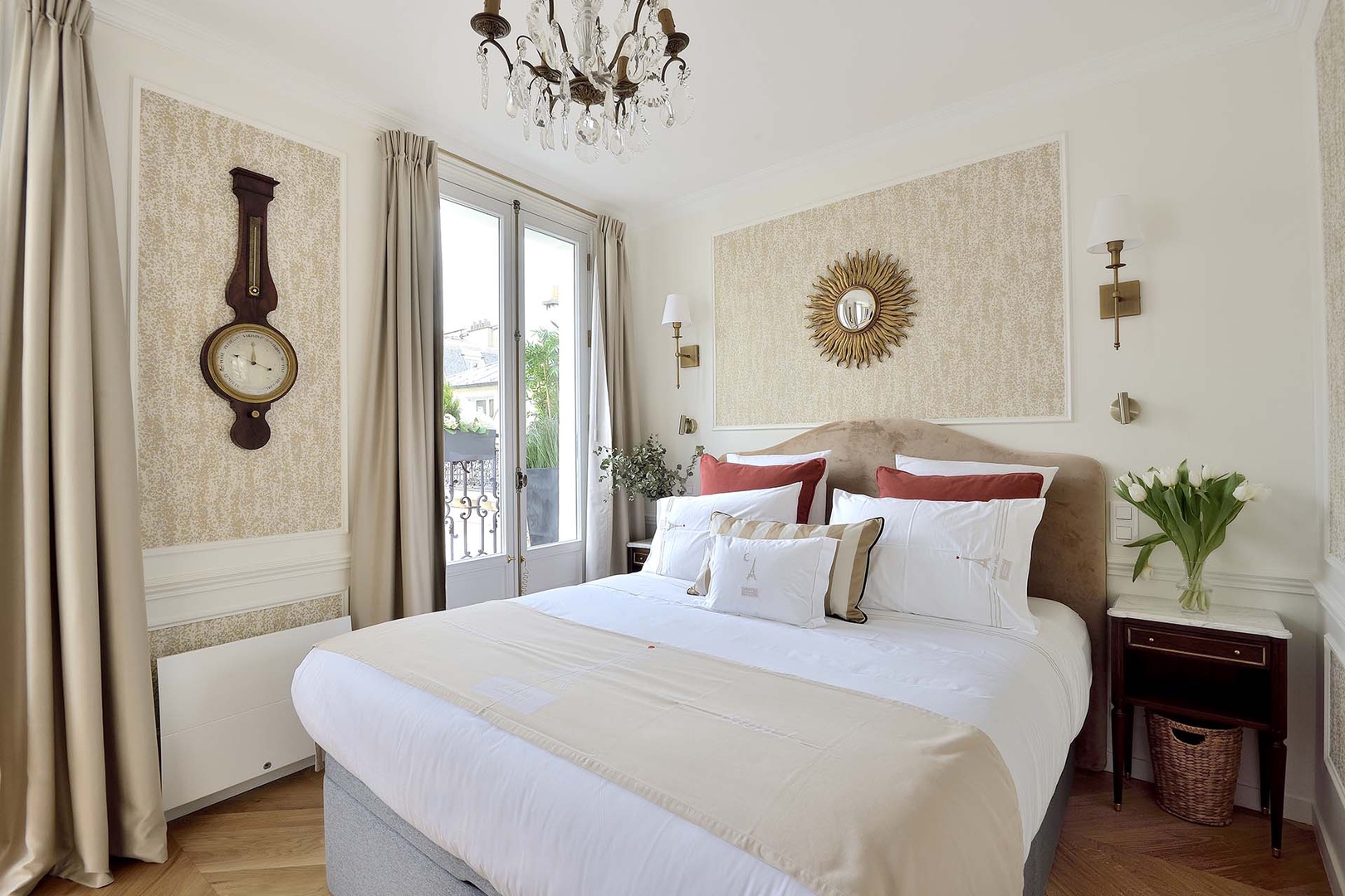 Bedroom 1 has two French doors opening to the balcony.