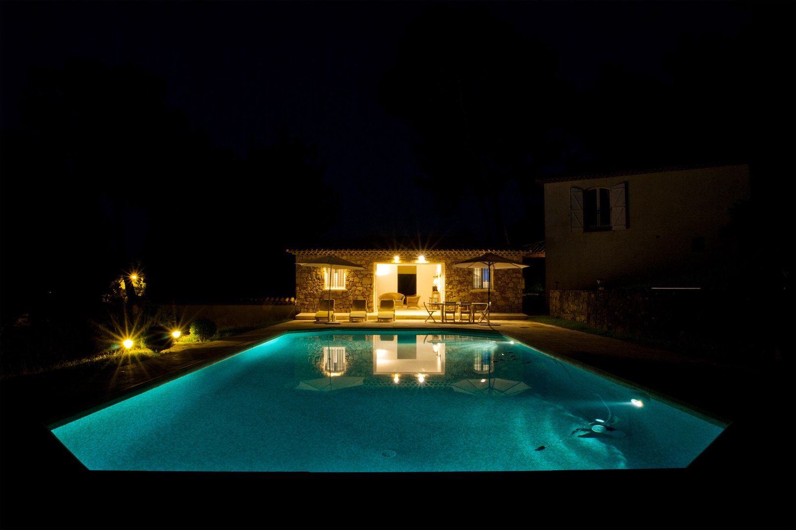 Enjoy a nighttime view of the pool