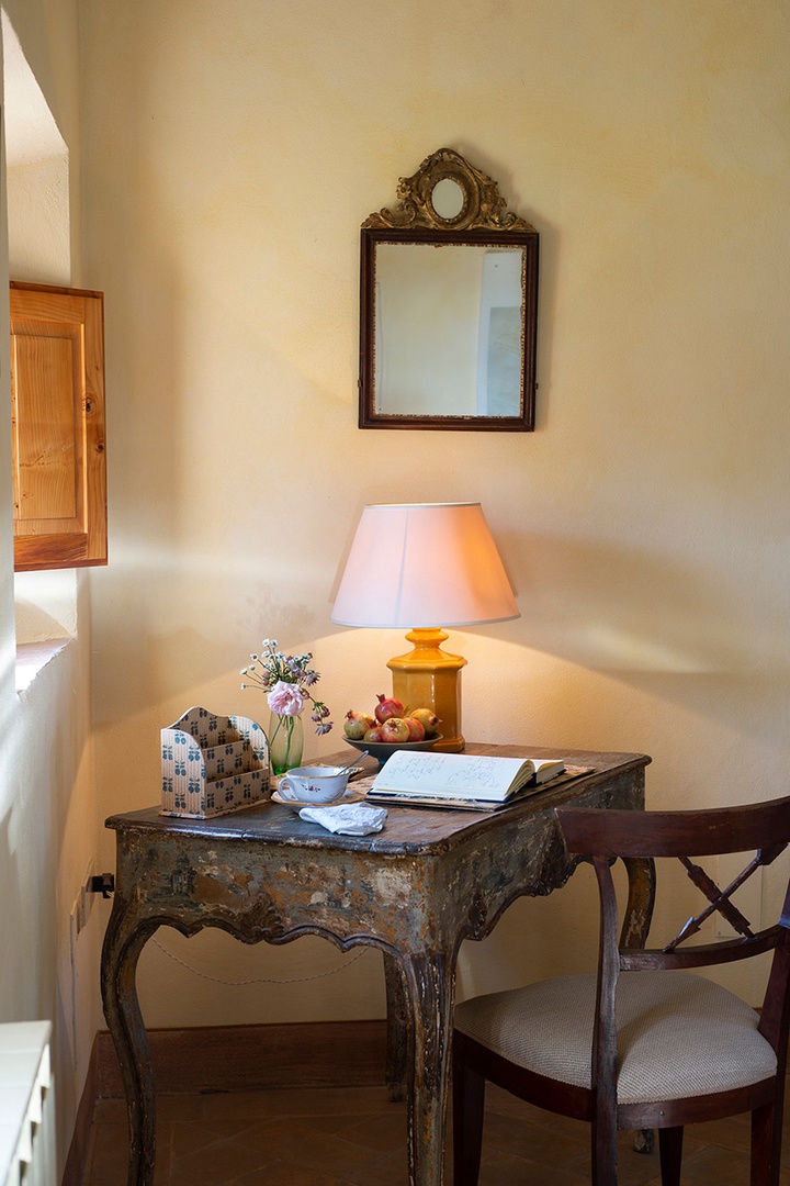 Antique writing desk in the living room corner.