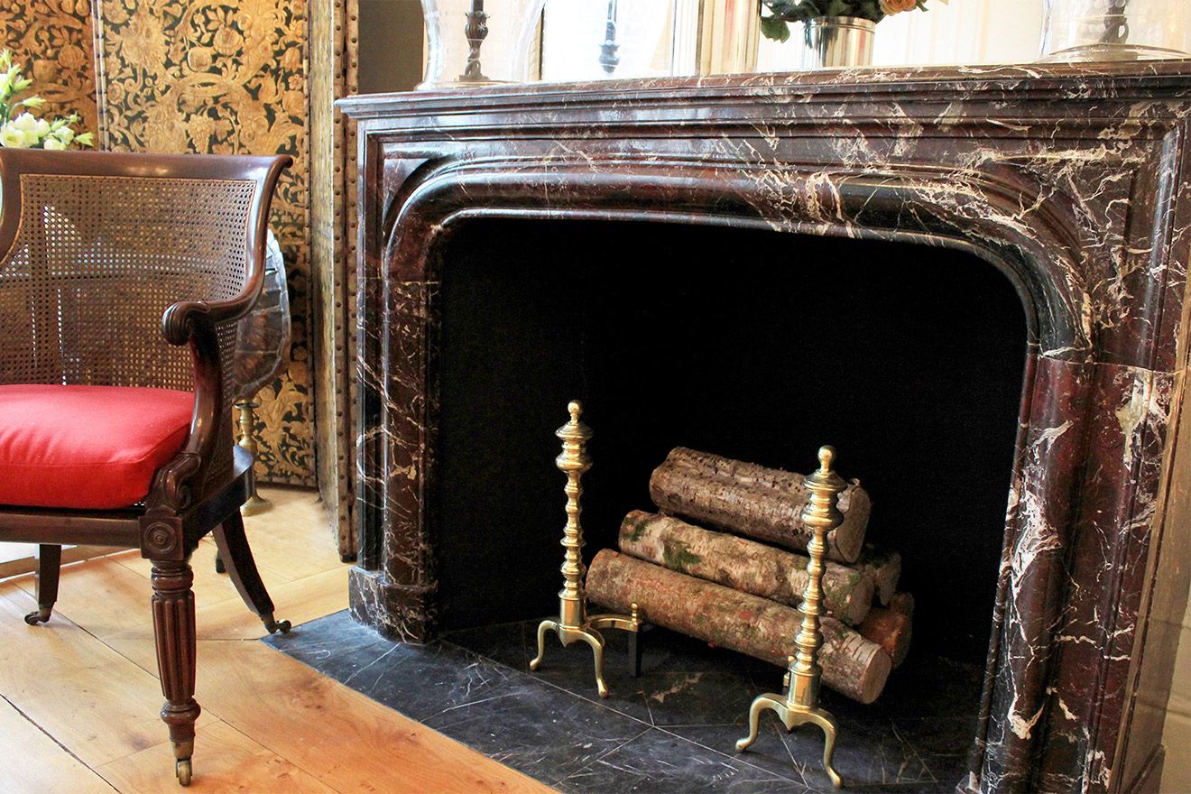 Gorgeous historic fireplace mantle in living room