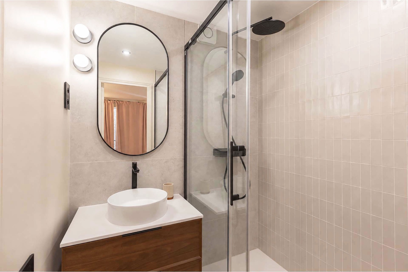 Bathroom with sink and large shower.