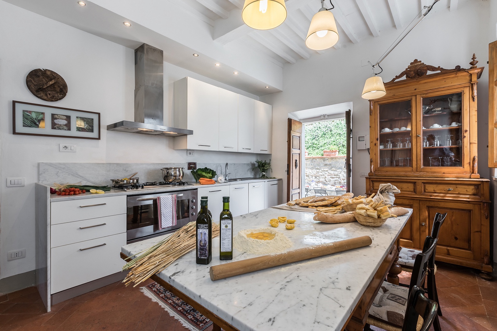 Excellent light in the cook's kitchen. See out the door to the dining terrace.