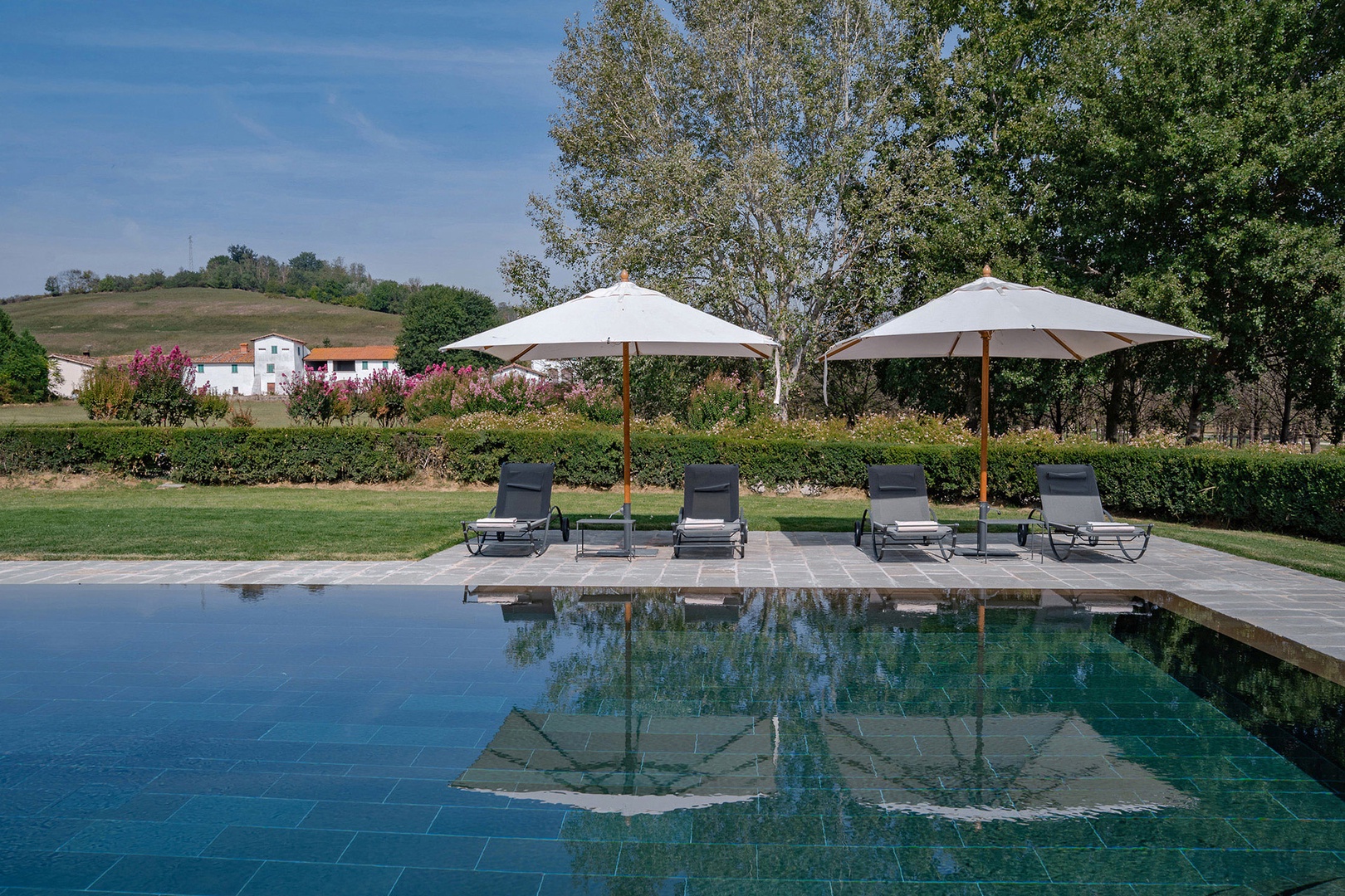 Soak up the Tuscan sun around the private infinity pool.