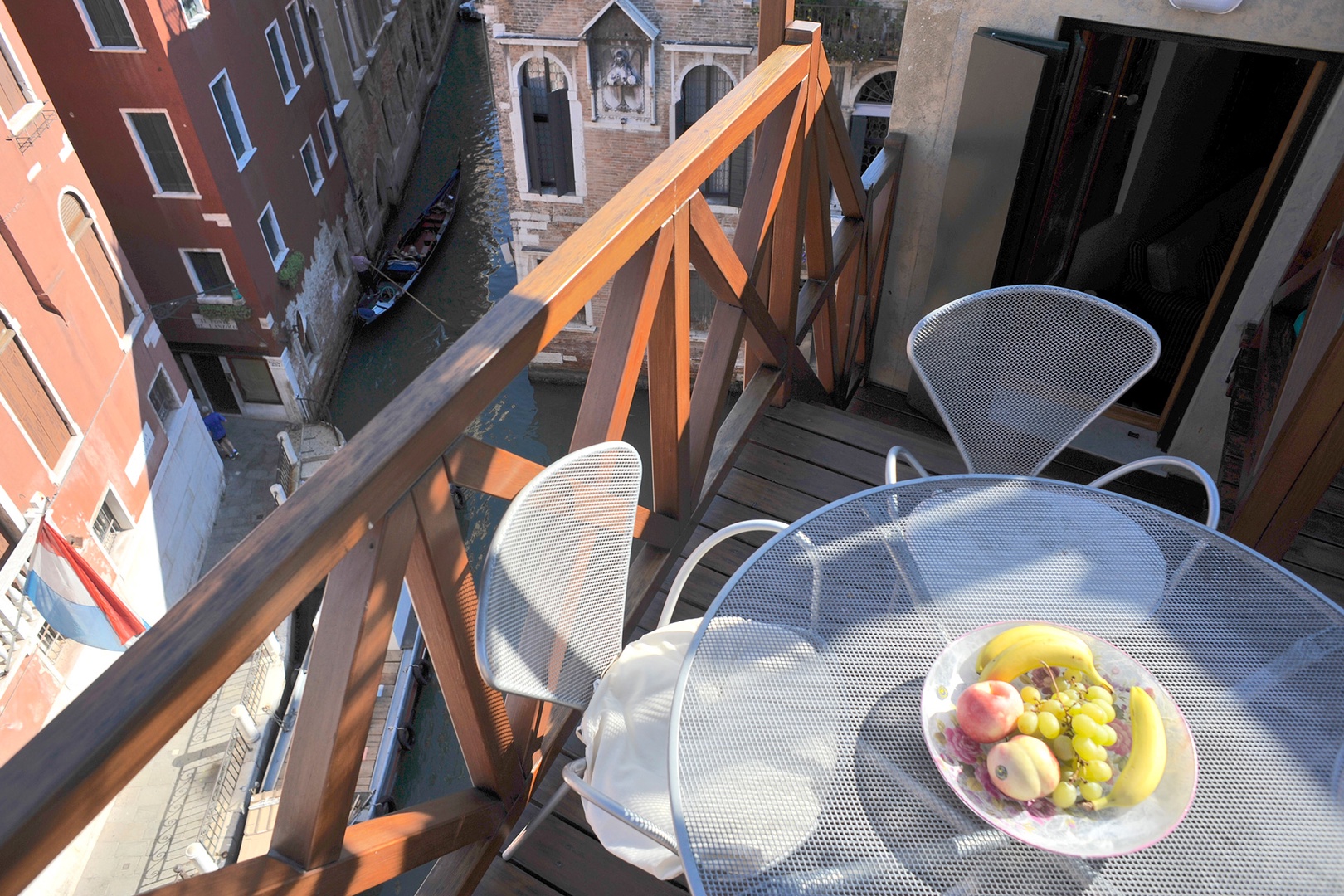 A table on the terrace welcomes dining al fresco while enjoying the view.