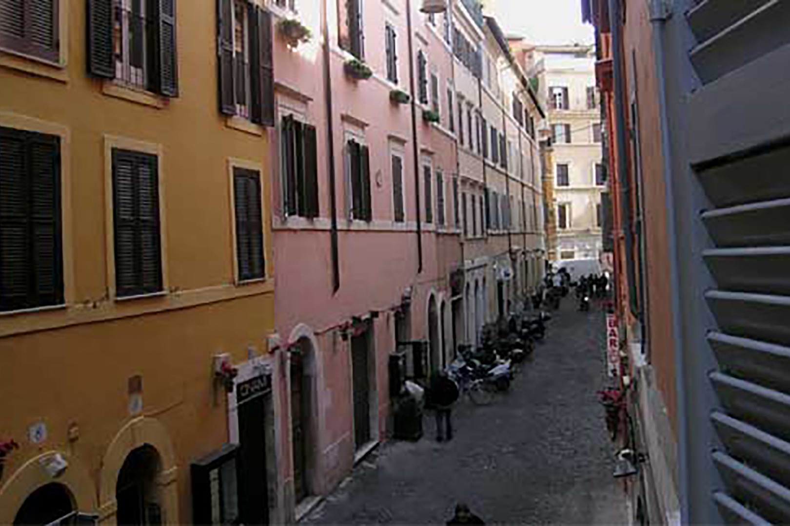 View from the apartment towards the left. Typical Roman colors adorn the buildings.
