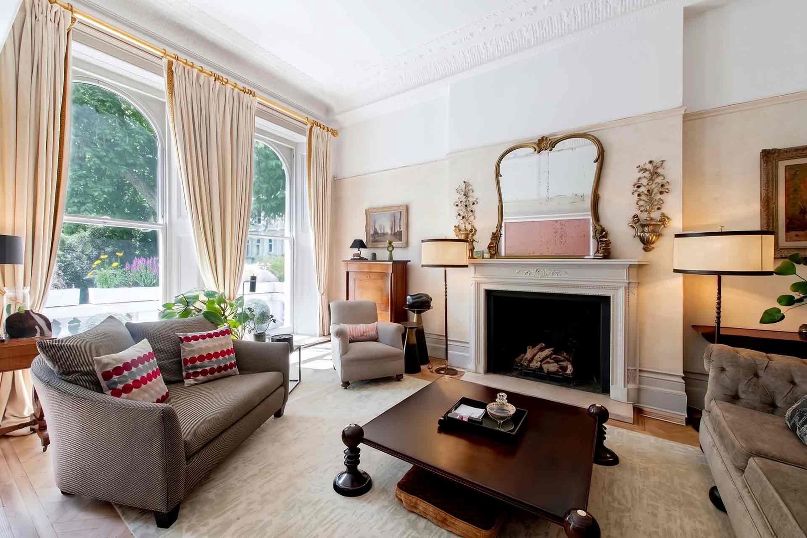 Large windows fill the living room with light.